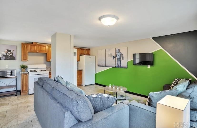 4377 Rialto Street San Diego, CA 92107 - Photo 4 of 15 a living room with furniture and a large window