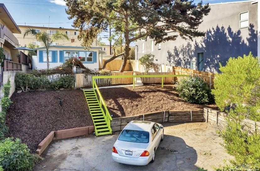 4377 Rialto Street San Diego, CA 92107 - Photo 8 of 15 a front view of a house with a garden