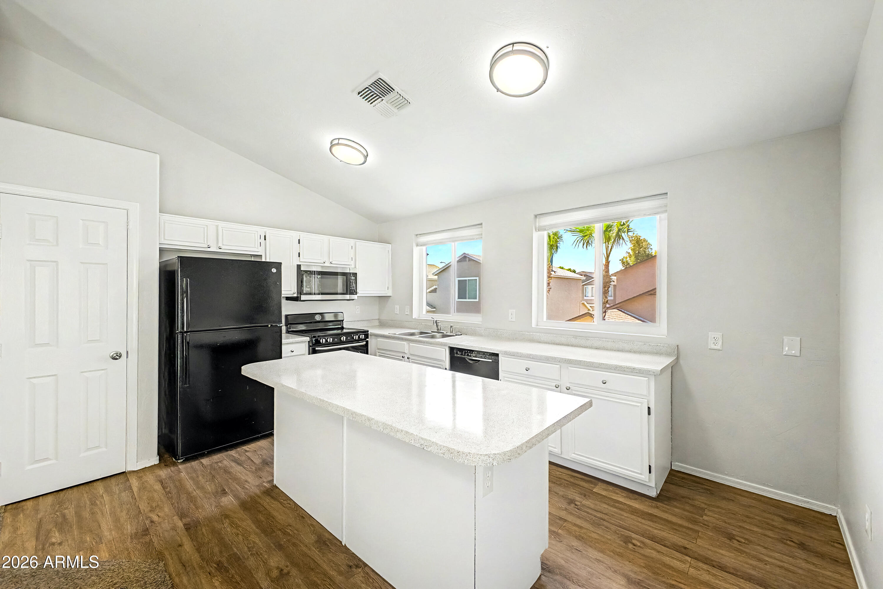 3134 East McKellips Road, Unit 221 Mesa, AZ 85213 - Photo 7 of 29 a kitchen with a sink appliances and cabinets