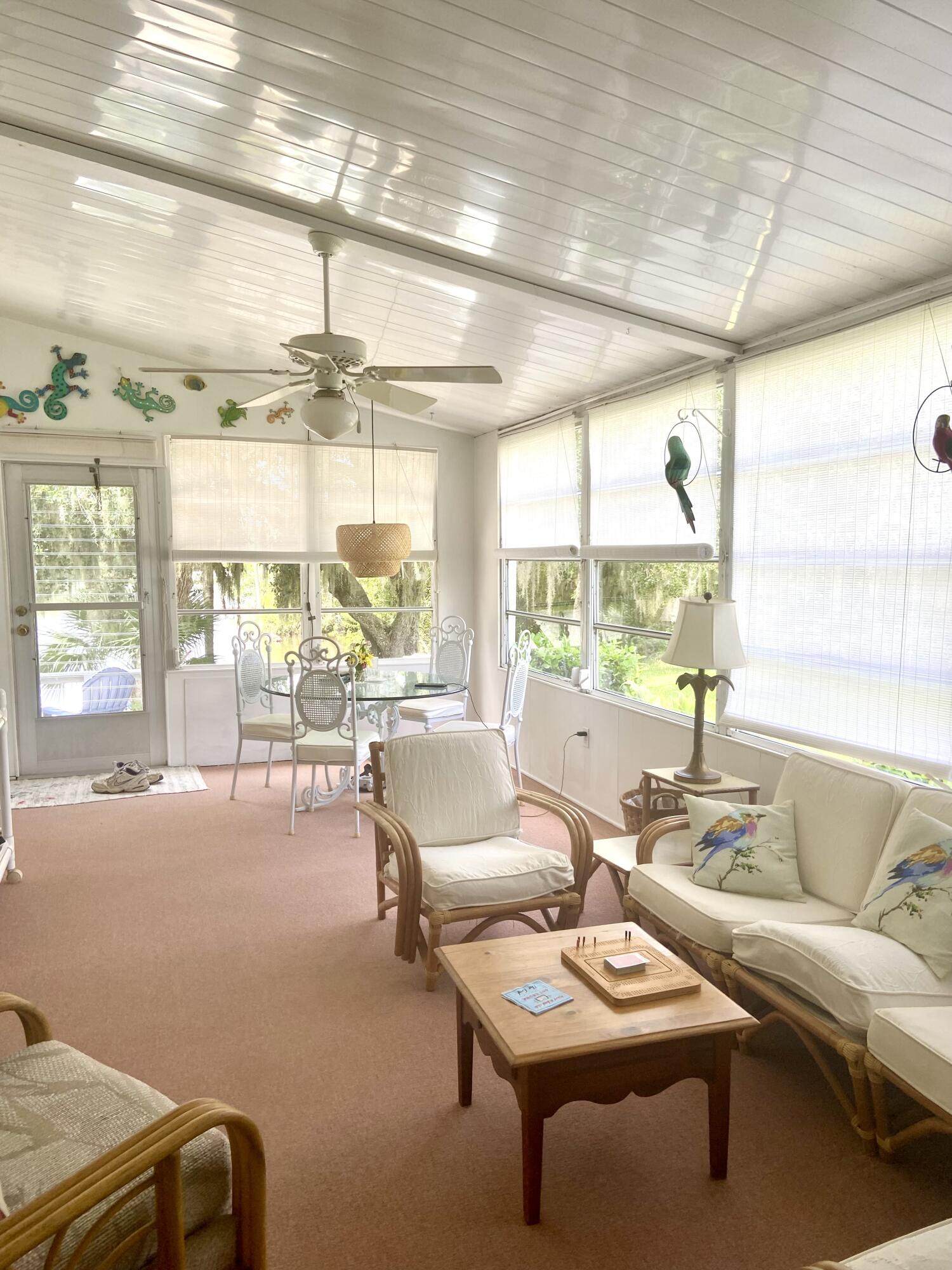 29 Quintana Roo Lane Port St. Lucie, FL 34952 - Photo 18 of 51 a living room with furniture and a large window