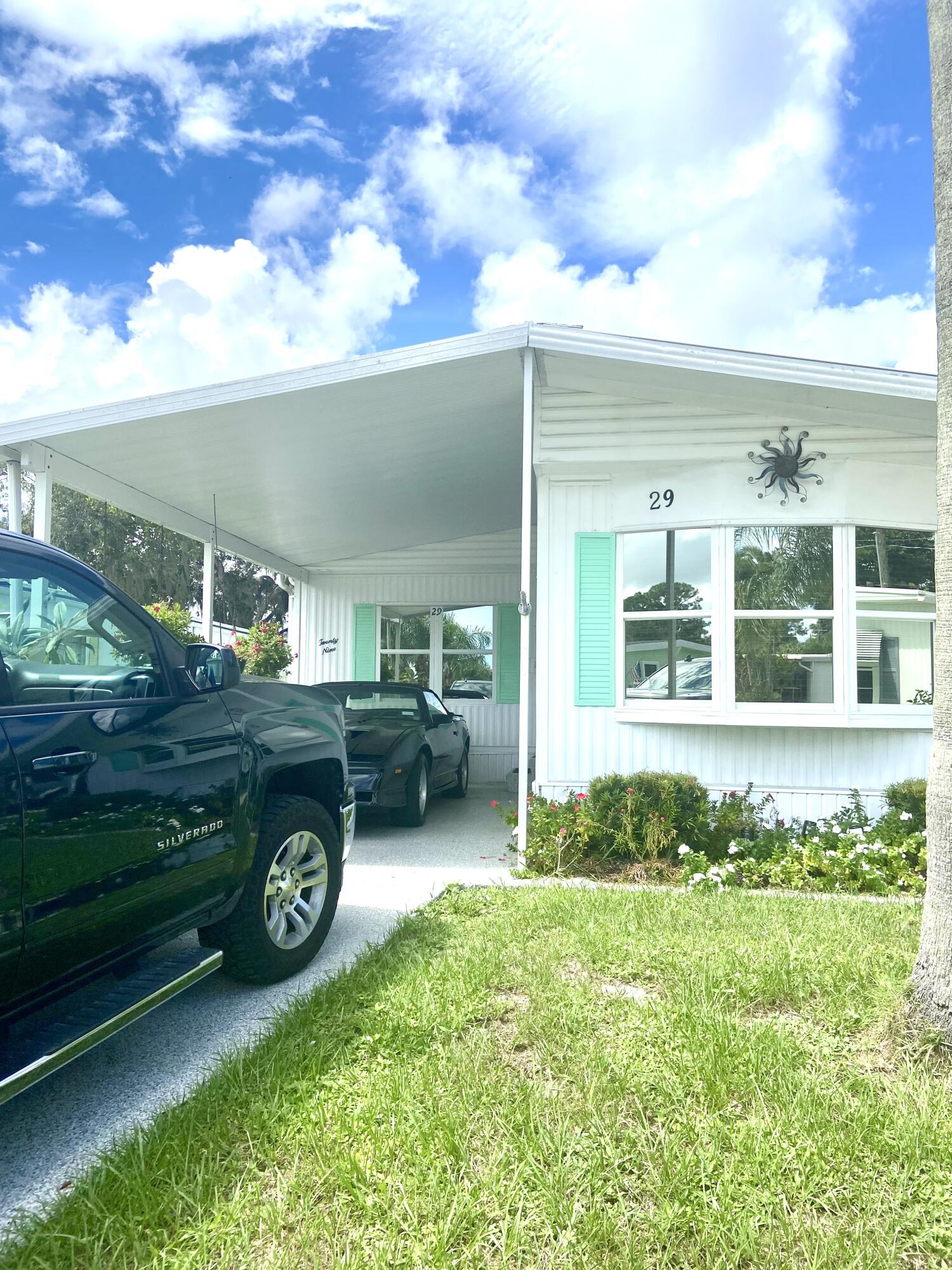 29 Quintana Roo Lane Port St. Lucie, FL 34952 - Photo 2 of 51 a view of a backyard with a garden and plants