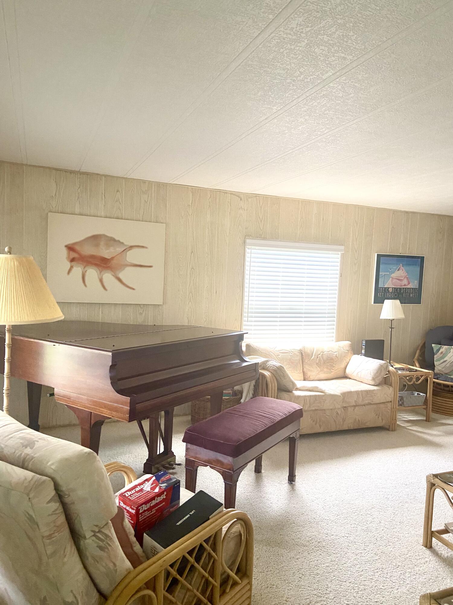 29 Quintana Roo Lane Port St. Lucie, FL 34952 - Photo 23 of 51 a living room with furniture and a window