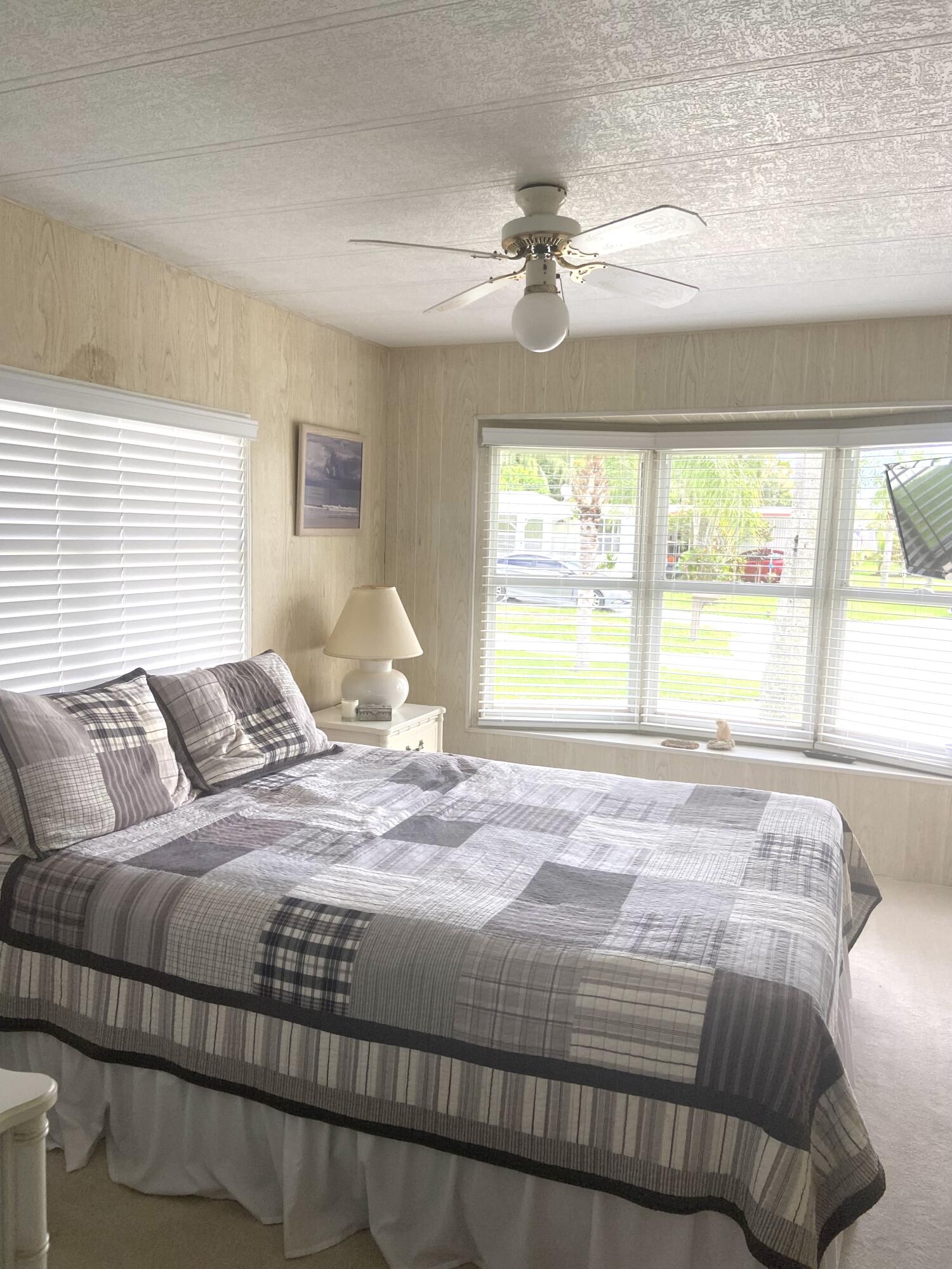 29 Quintana Roo Lane Port St. Lucie, FL 34952 - Photo 28 of 51 a bedroom with a bed and window