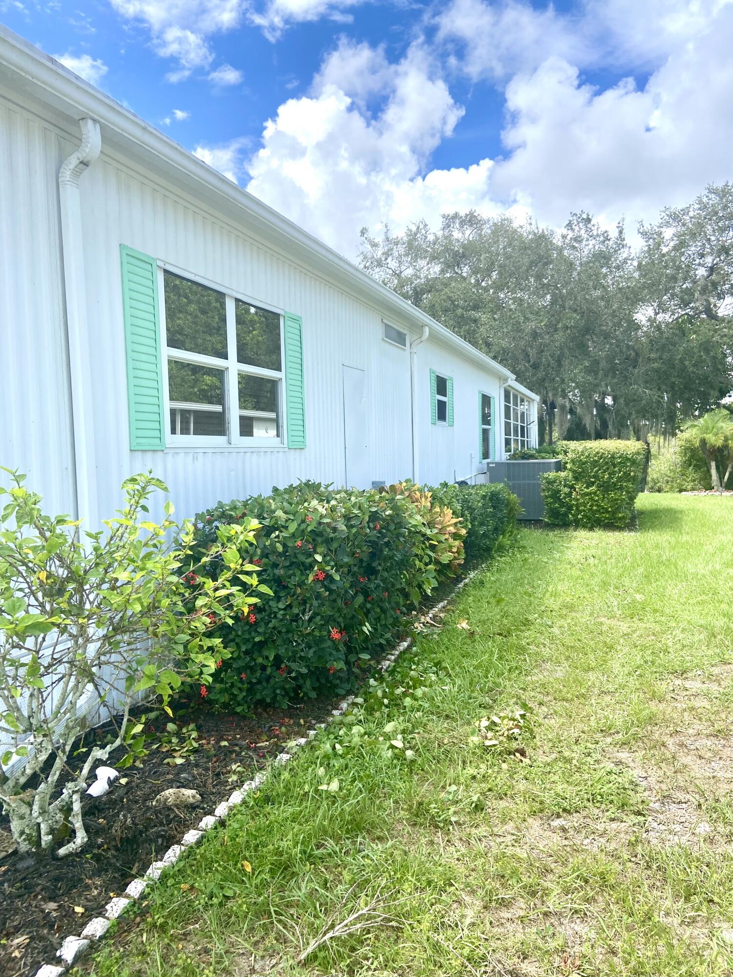 29 Quintana Roo Lane Port St. Lucie, FL 34952 - Photo 3 of 51 a house view with a garden space