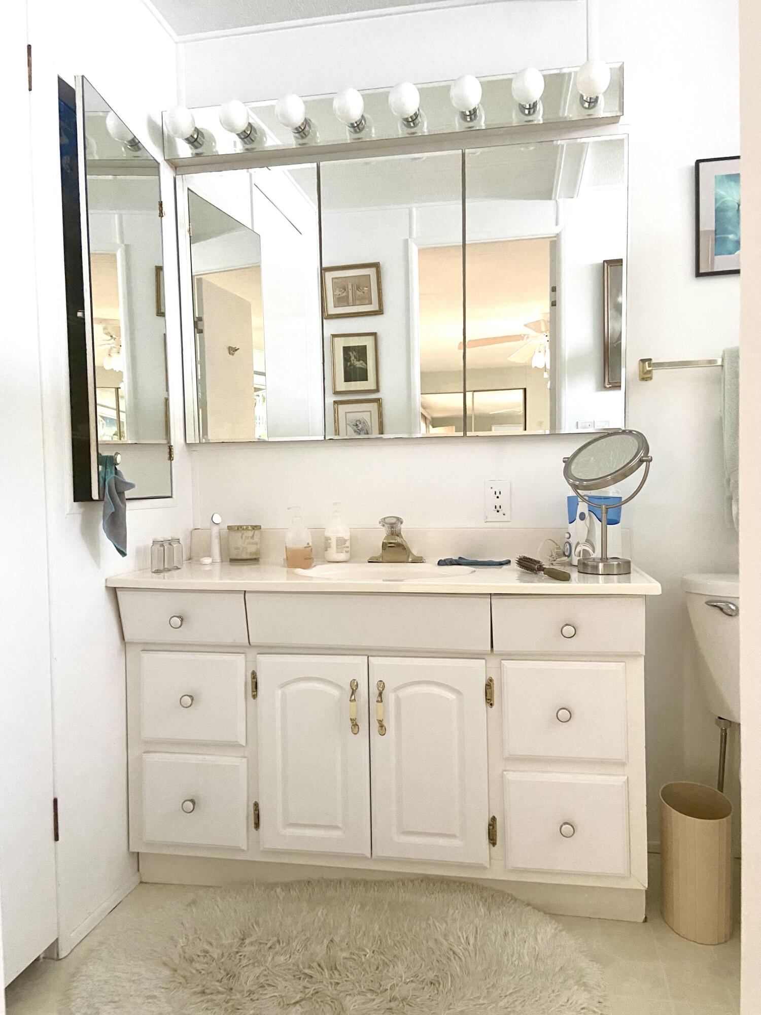 29 Quintana Roo Lane Port St. Lucie, FL 34952 - Photo 31 of 51 a bathroom with a granite countertop sink mirror and
