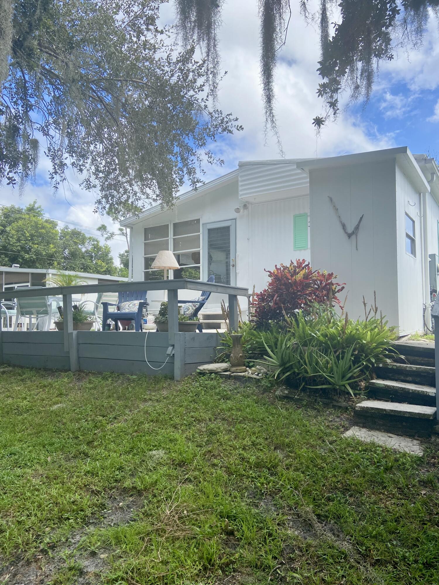 29 Quintana Roo Lane Port St. Lucie, FL 34952 - Photo 5 of 51 a view of a house with a yard and sitting area
