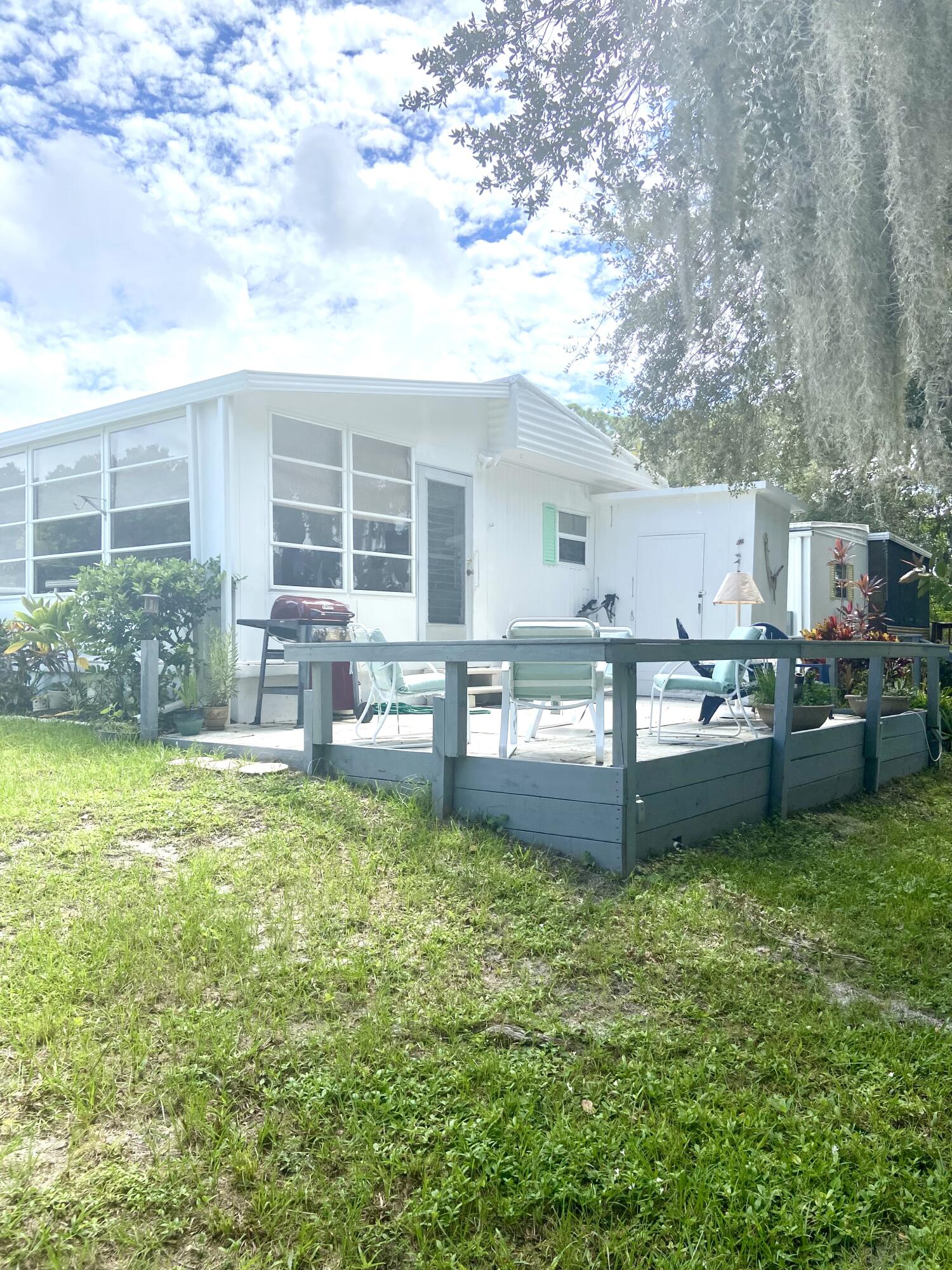 29 Quintana Roo Lane Port St. Lucie, FL 34952 - Photo 7 of 51 a view of a house with a yard and sitting area