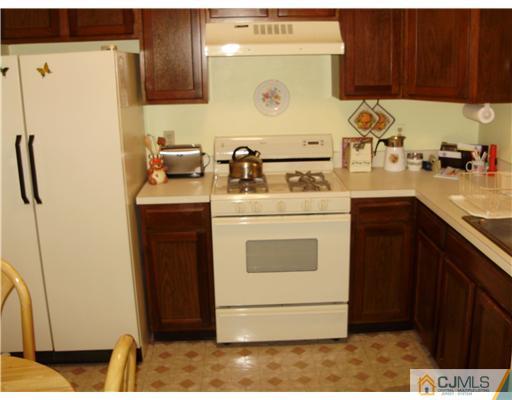 48 Woodbrook Road Edison, NJ 08820 - Photo 3 of 11 a kitchen with a sink and a stove