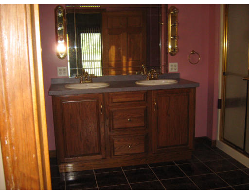 339 Somers Road Hampden, MA 01036 - Photo 7 of 10 a bathroom with a granite countertop sink a mirror and a shower