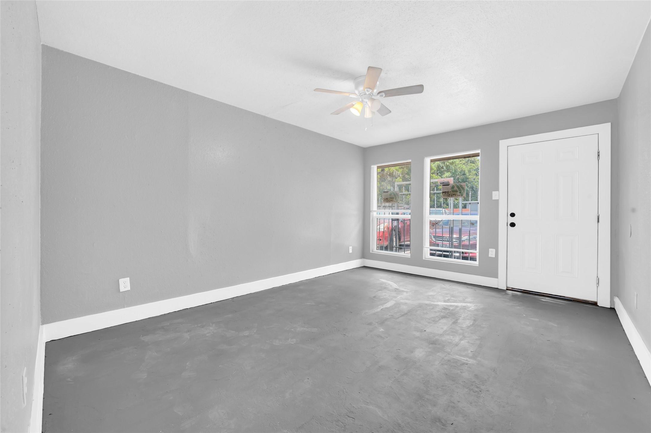 3802 Dabney Street, Unit 3 Houston, TX 77026 - Photo 2 of 13 an empty room with chandelier fan