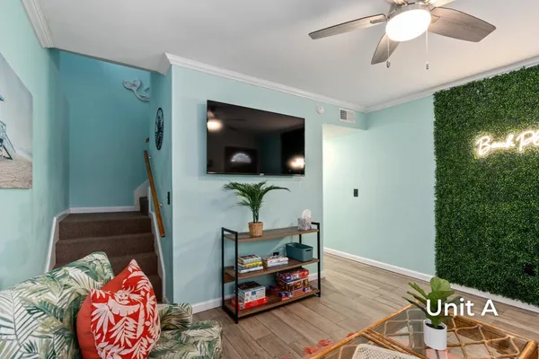 a bedroom with a bed and a tv