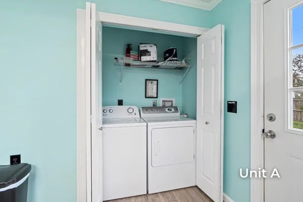 a kitchen with stainless steel appliances kitchen island granite countertop a refrigerator and microwave
