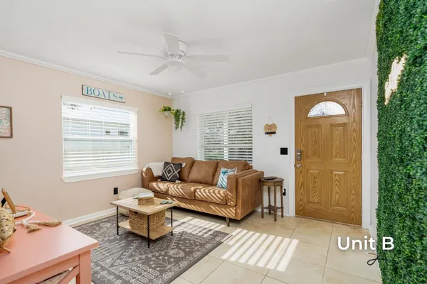 a kitchen with stainless steel appliances a refrigerator sink and microwave