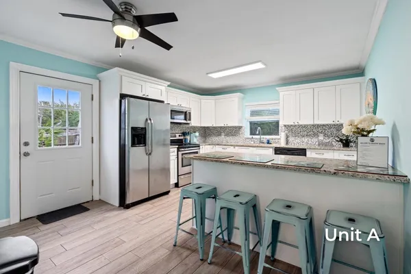 a bedroom with a bed and a large mirror