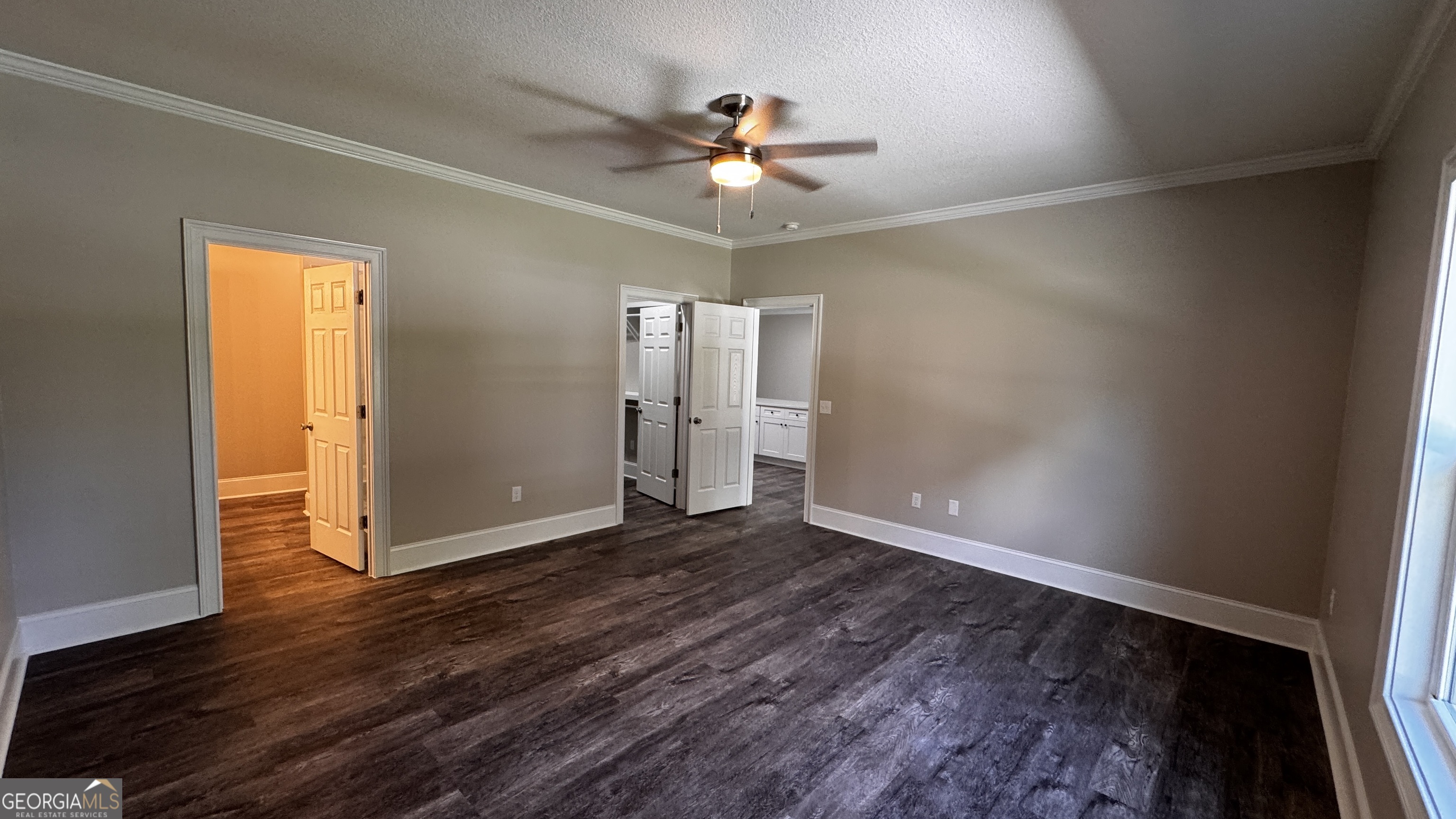 3 Willow Pointe Claxton, GA 30417 - Photo 23 of 31 an empty room with wooden floor chandelier fan and windows