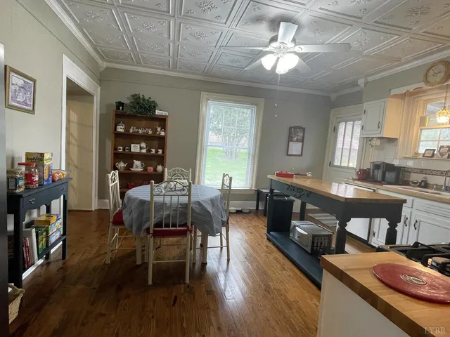 a dining room with furniture and window