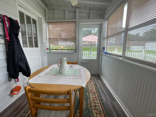 a living room with furniture a lamp and a fireplace