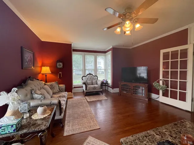 a bedroom with furniture and a flat screen tv