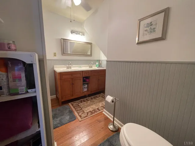 a bedroom with two beds and a chandelier