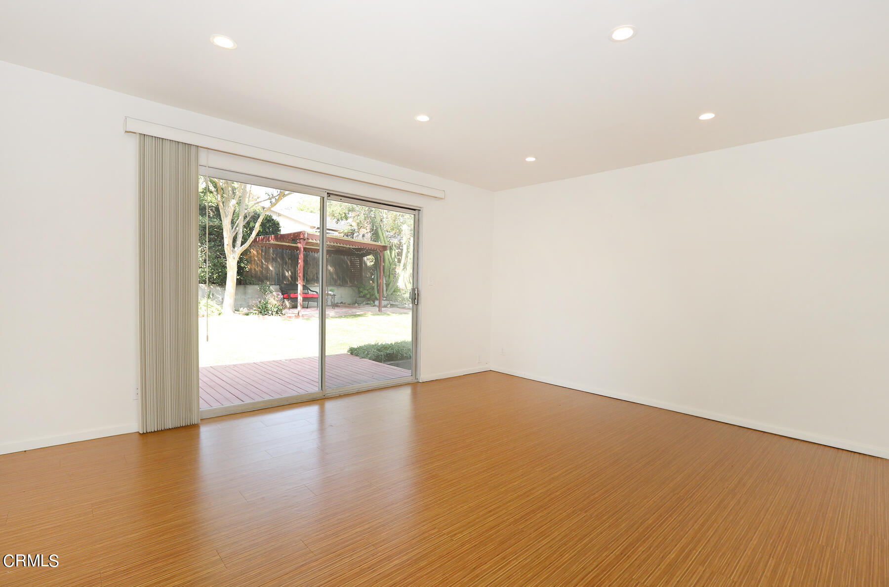 1026 Crestview Drive Pasadena, CA 91107 - Photo 12 of 29 an empty room with wooden floor and windows