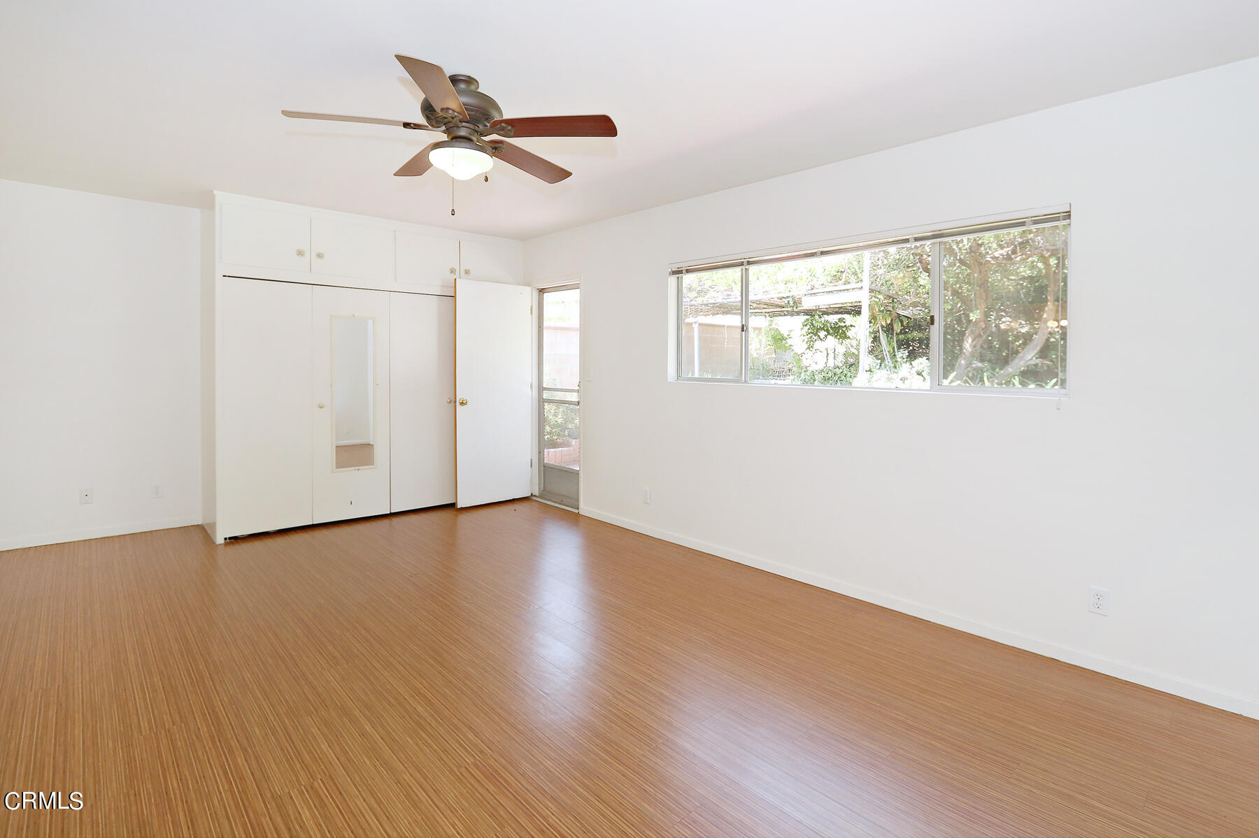 1026 Crestview Drive Pasadena, CA 91107 - Photo 13 of 29 an empty room with wooden floor chandelier fan and windows