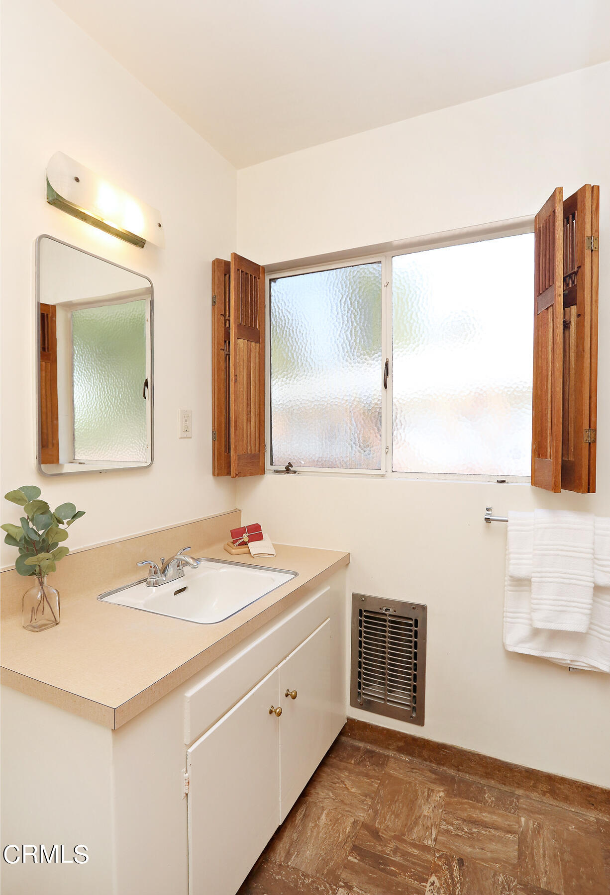1026 Crestview Drive Pasadena, CA 91107 - Photo 18 of 29 a bathroom with a double vanity sink and a mirror