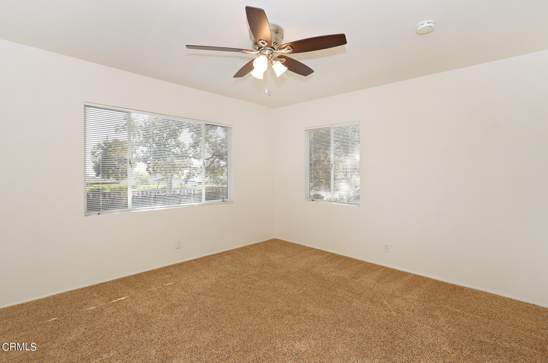 1026 Crestview Drive Pasadena, CA 91107 - Photo 23 of 29 an empty room with windows and fan