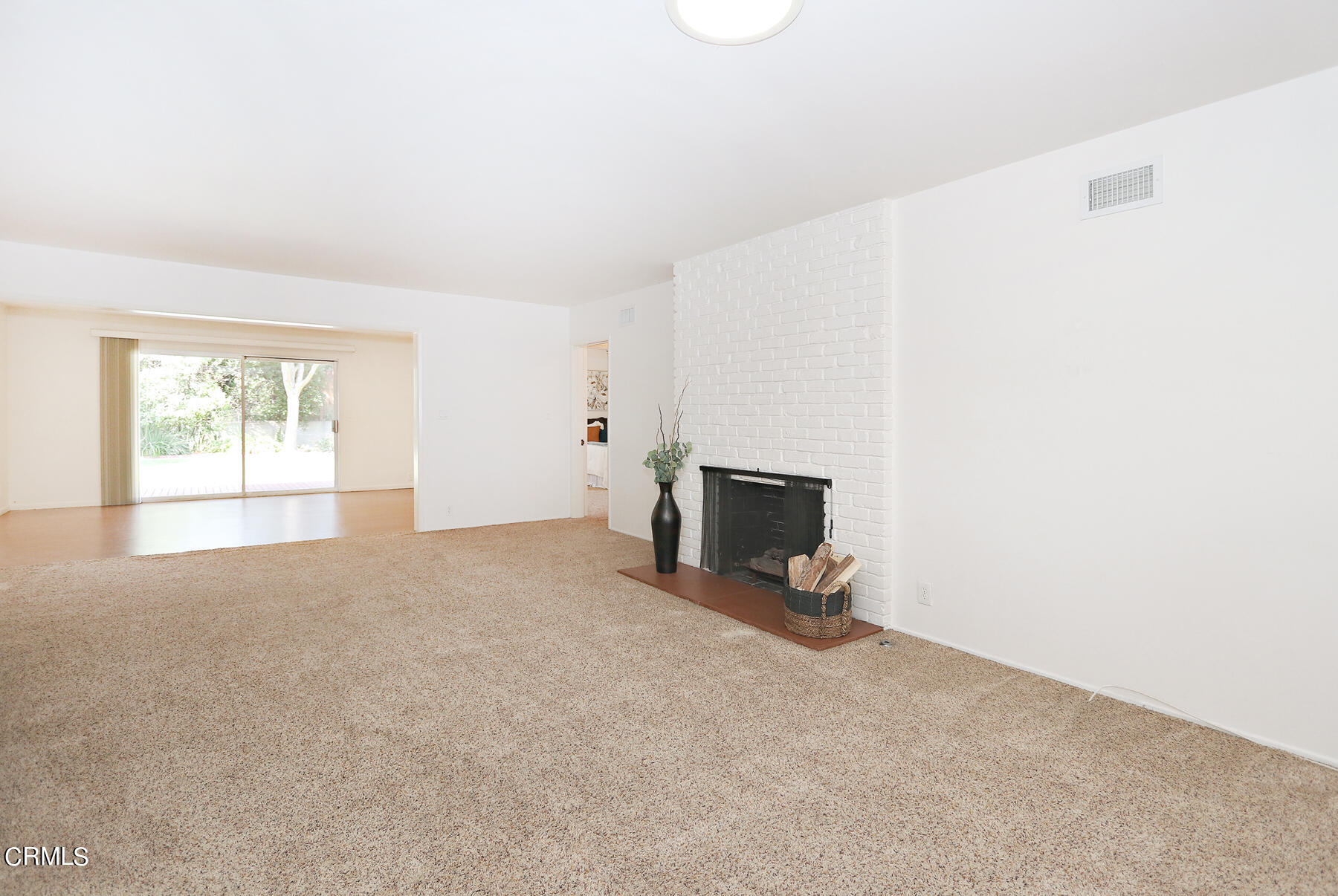 1026 Crestview Drive Pasadena, CA 91107 - Photo 6 of 29 a view of an empty room with a fireplace