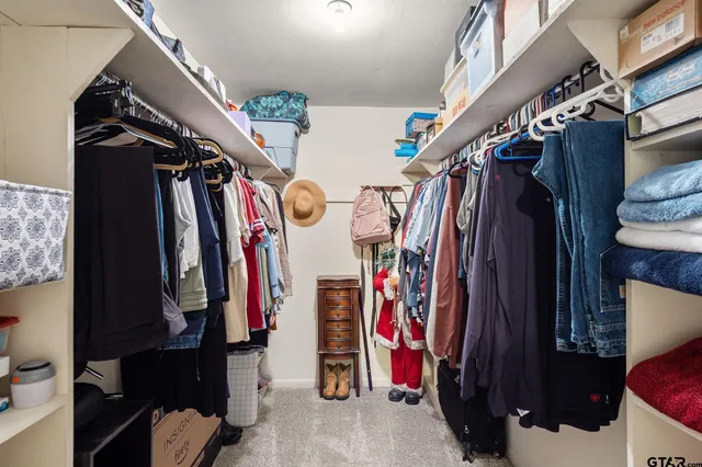 a view of a hallway with storage and utility