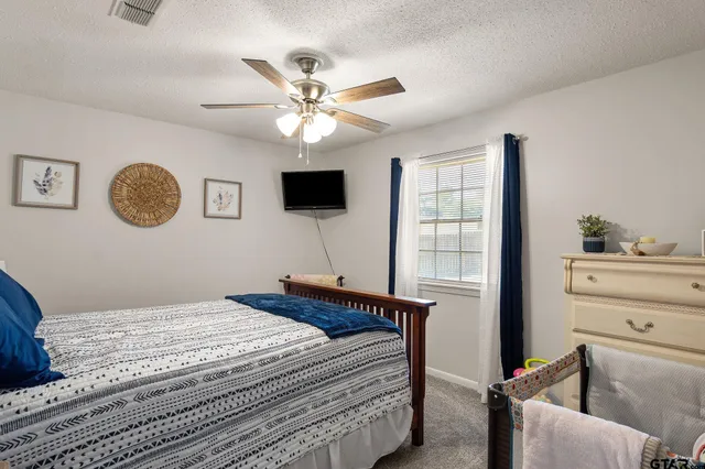 a bathroom with a sink mirror and vanity