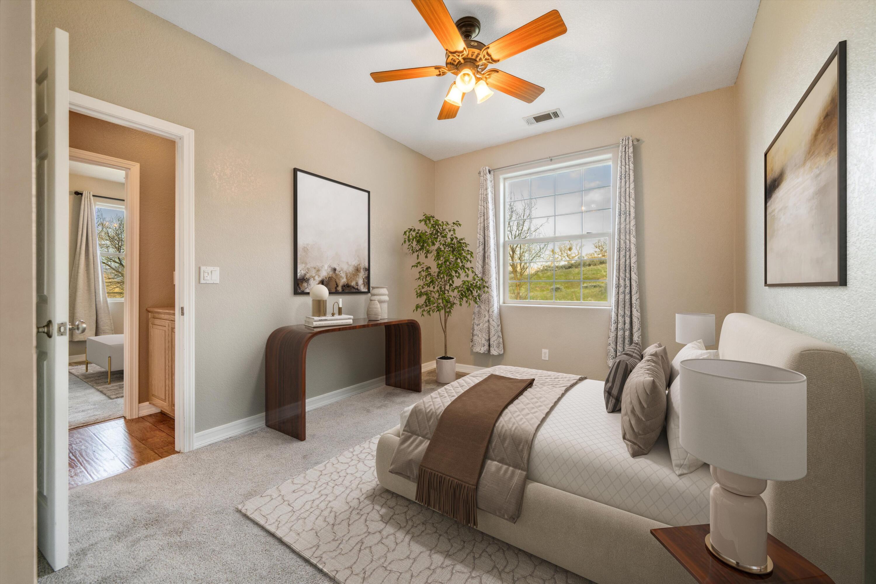 28321 Pimlico Way Tehachapi, CA 93561 - Photo 14 of 23 a bedroom with a bed and a chandelier