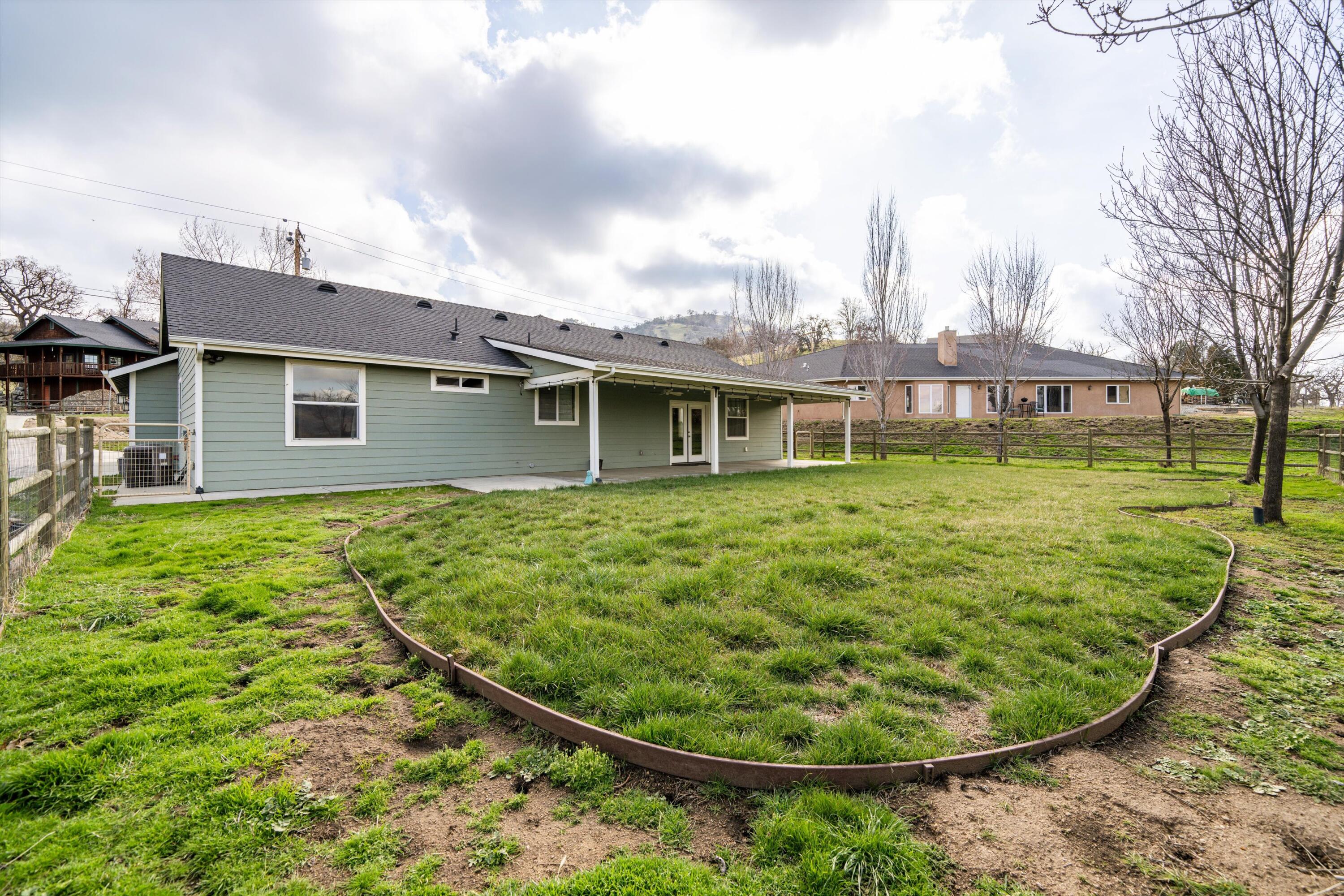 28321 Pimlico Way Tehachapi, CA 93561 - Photo 16 of 23 a view of a house with a backyard