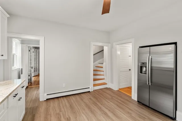 a bathroom with a granite countertop sink a shower and a mirror