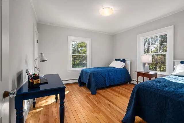 a dining room with furniture and a window