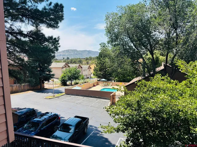 swimming pool view with a seating space