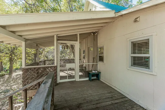 a view of a porch and a floor to ceiling window