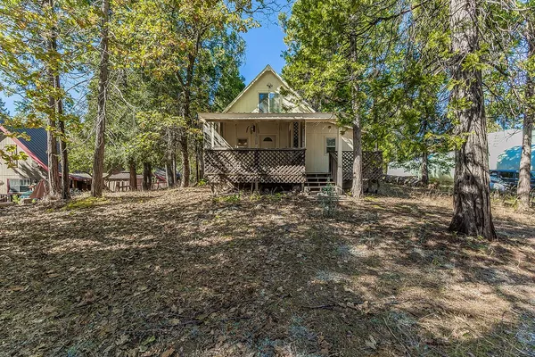 a house with trees in the background