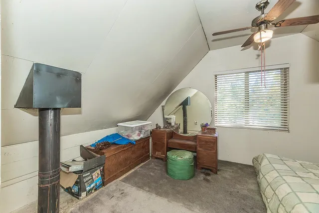 a bedroom with a bed and a walk in closet