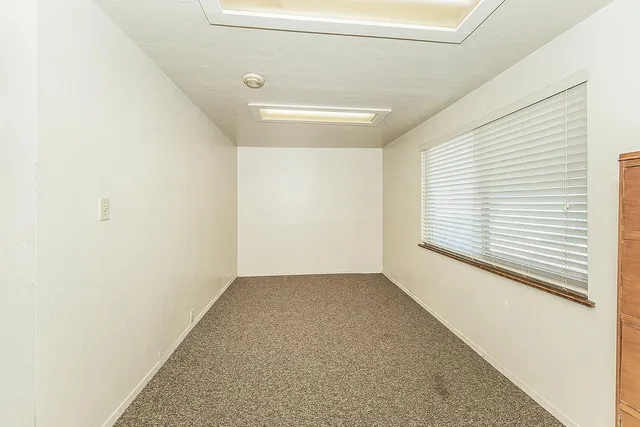 a view of a room that has a window in it