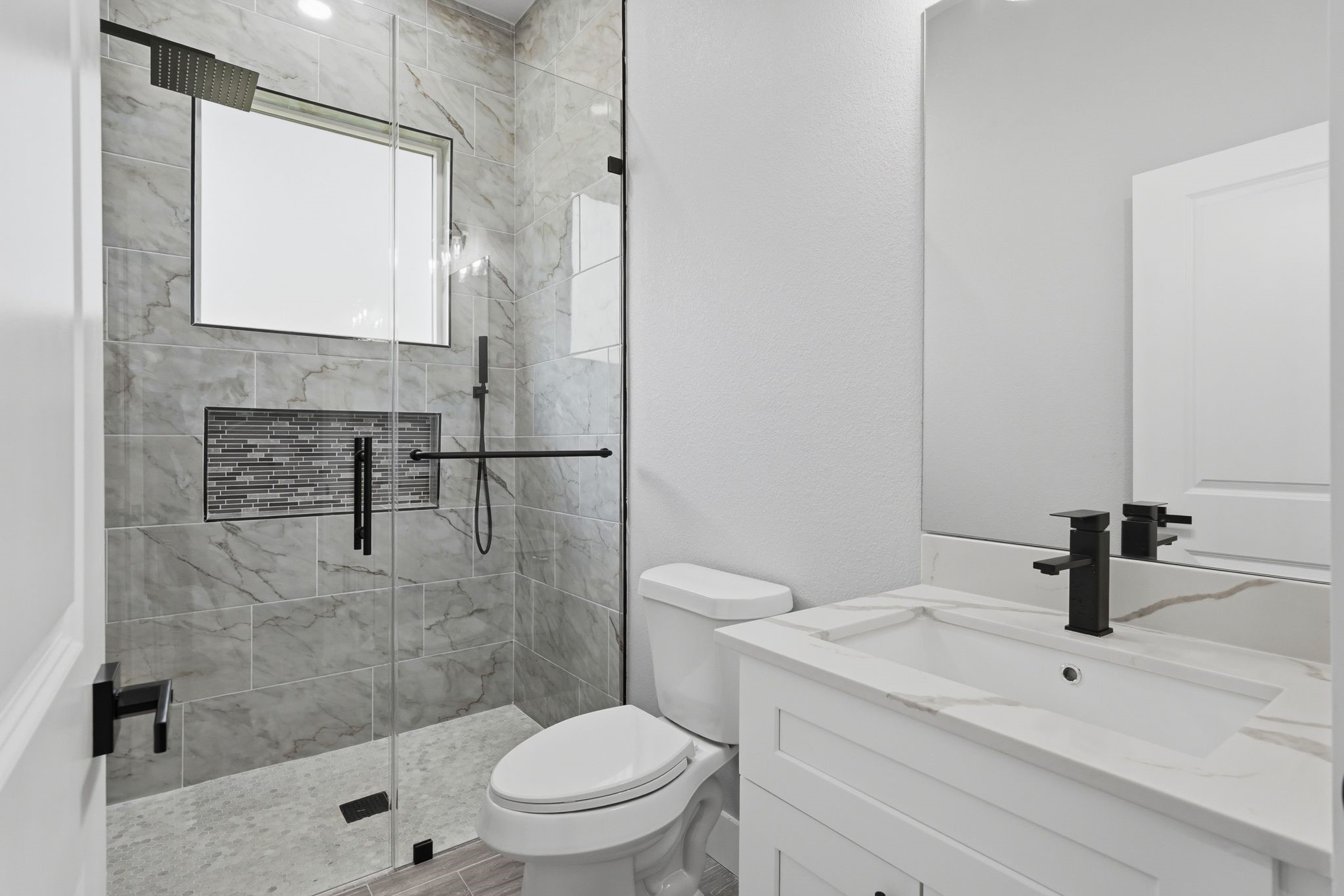 3575 Roy Bean Road Willis, TX 77378 - Photo 25 of 40 a bathroom with a sink a toilet and shower