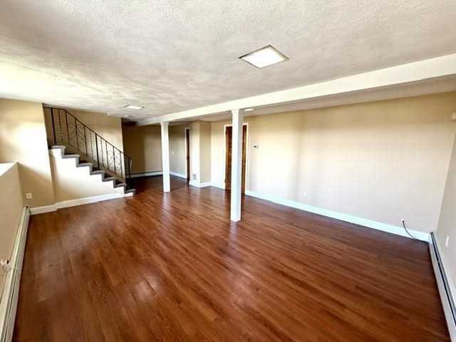 116 Upton Road Waltham, MA 02452 - Photo 16 of 22 a view of empty room with wooden floor