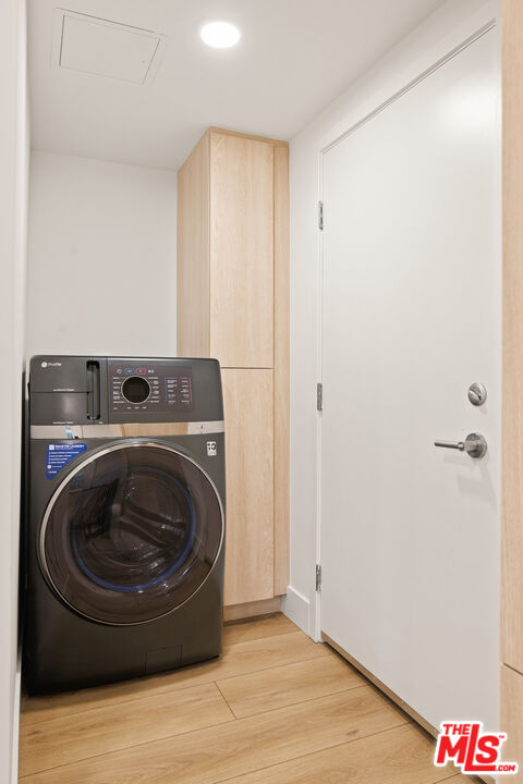 2811 3rd Street, Unit 13 Santa Monica, CA 90405 - Photo 2 of 13 a utility room with wooden floor washer and dryer