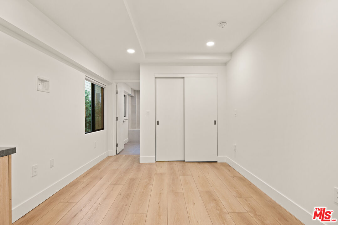 2811 3rd Street, Unit 13 Santa Monica, CA 90405 - Photo 4 of 13 a view of a room with wooden floor and window