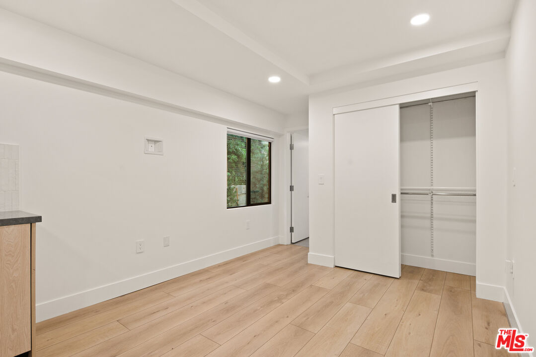 2811 3rd Street, Unit 13 Santa Monica, CA 90405 - Photo 5 of 13 a view of an empty room with wooden floor