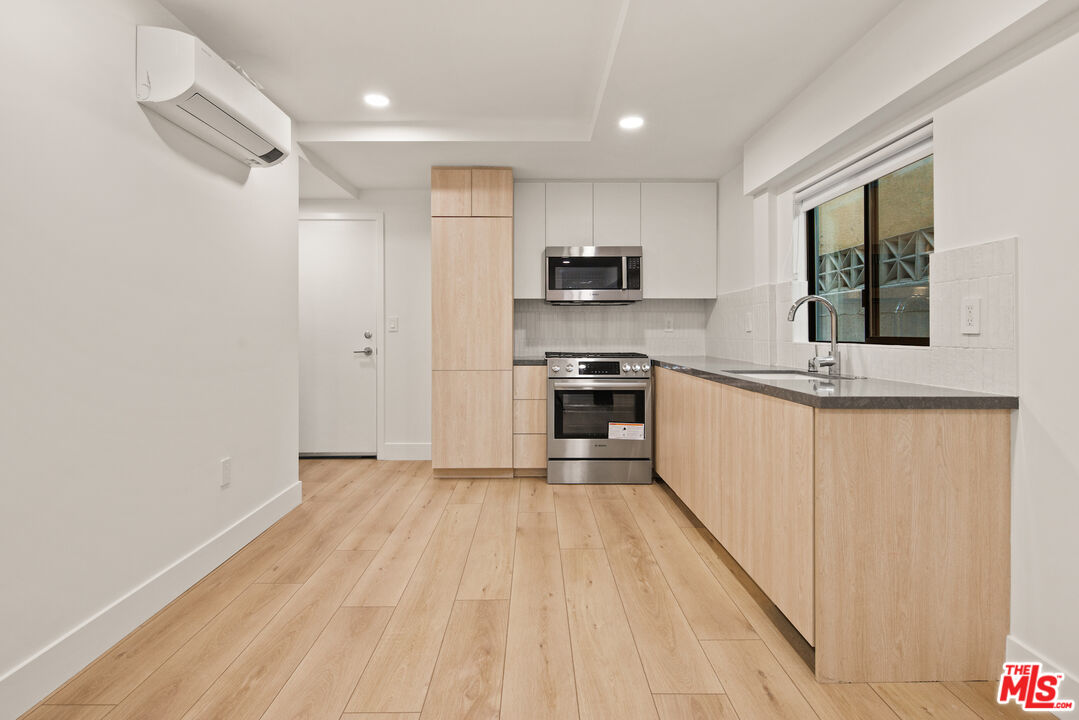 2811 3rd Street, Unit 13 Santa Monica, CA 90405 - Photo 8 of 13 a view of kitchen with sink window and stainless steel appliances