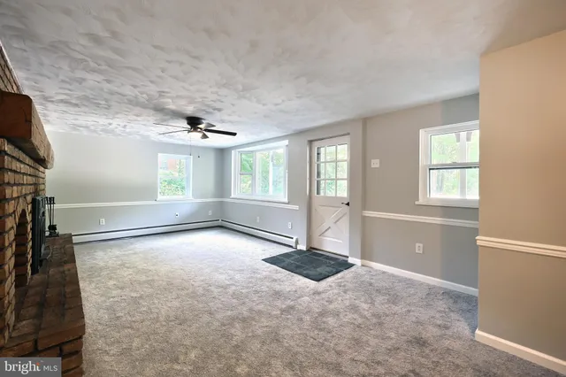 a large kitchen with stainless steel appliances granite countertop a stove and a sink