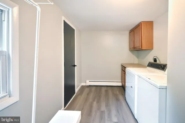 an aerial view of residential house with outdoor space and sign board