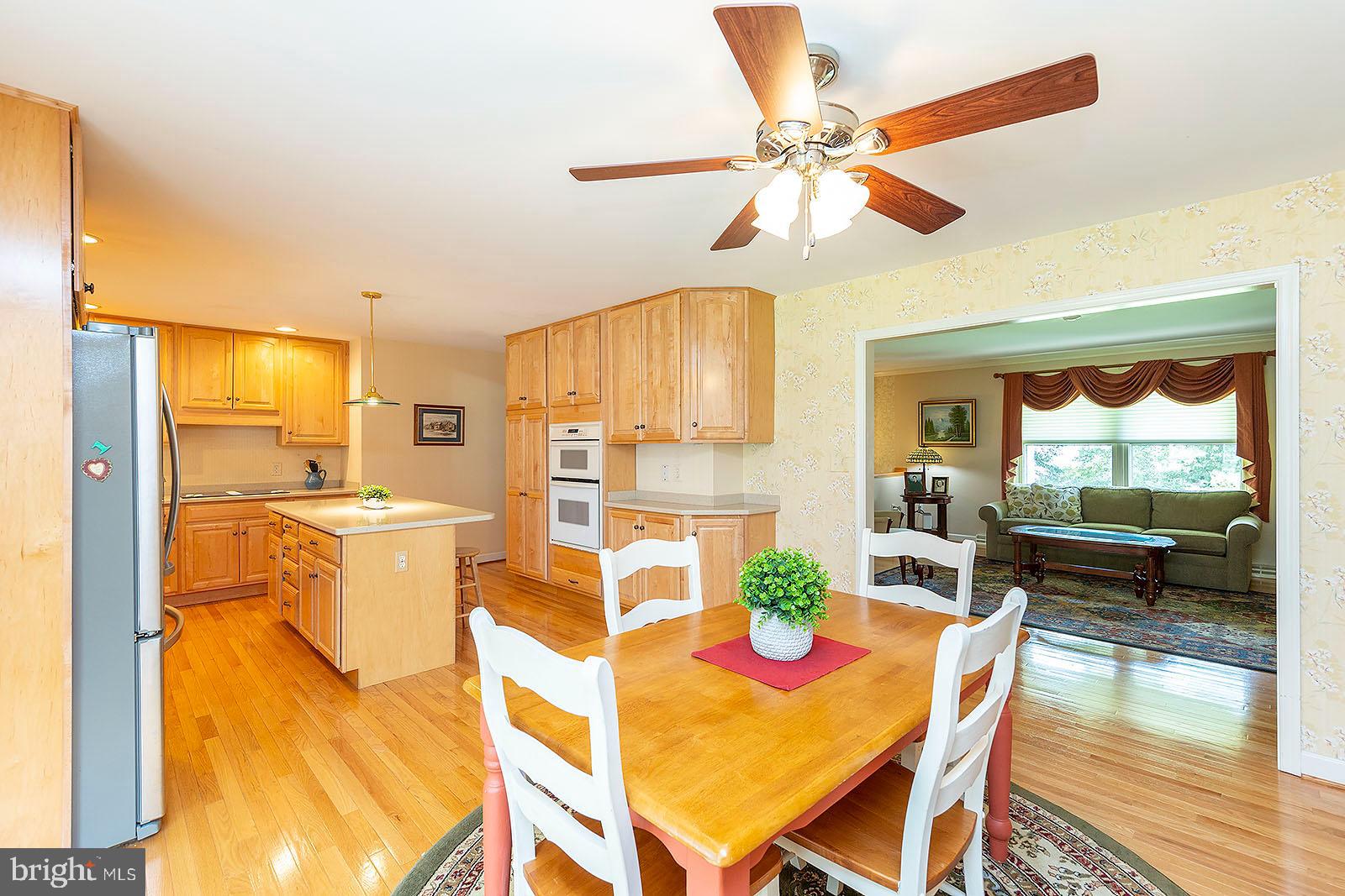 127 Stonebrook Road Winchester, VA 22602 - Photo 13 of 64 Hardwood floors in dining room & kitchen