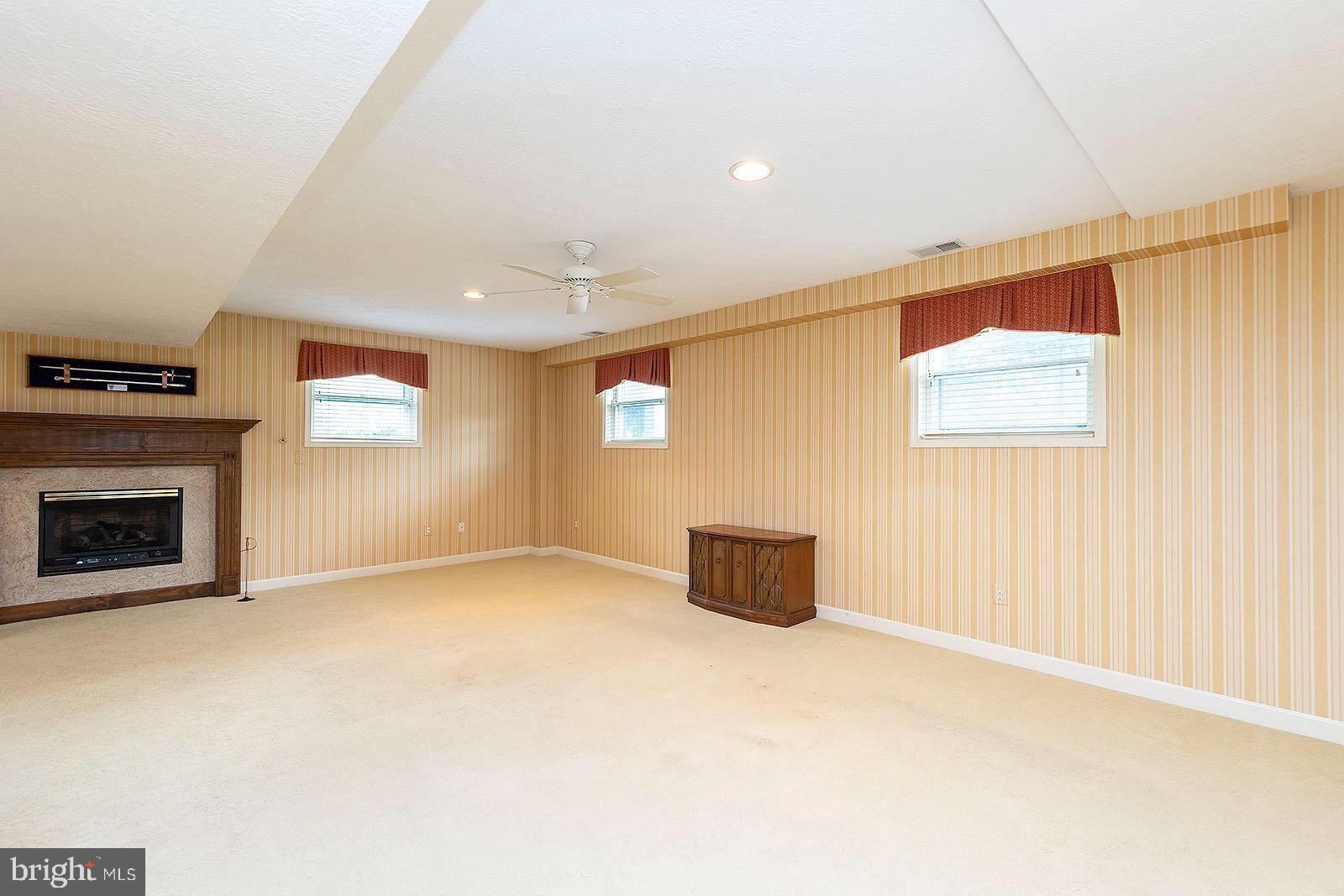 127 Stonebrook Road Winchester, VA 22602 - Photo 37 of 64 Lower level family room with gas fireplace