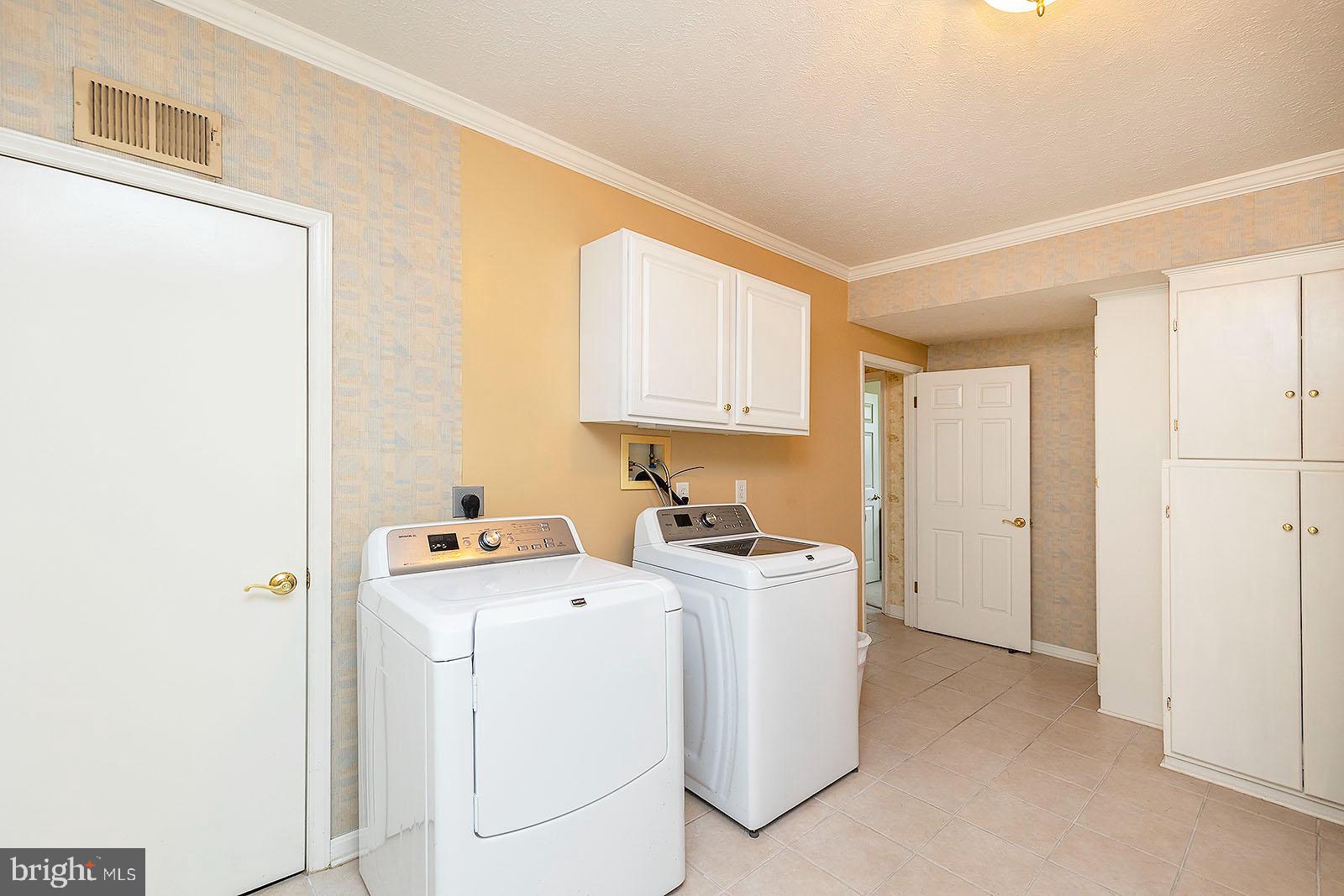 127 Stonebrook Road Winchester, VA 22602 - Photo 45 of 64 Large laundry room with cabinets